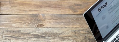 bigstock-Desk-of-blogger-Rough-wooden-d-108194648