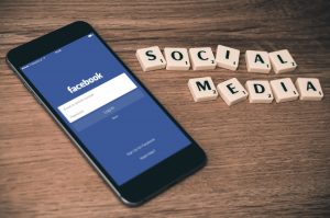 Facebook mobile, social media scrabble tiles | 6 Social Media Tips to Increase Engagement | Brighter Vision | Custom Websites & Online Marketing Solutions for Therapists