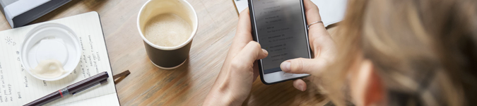 Woman using cell phone | Why & How to Keep the “Social” in Your Social Media Marketing | Brighter Vision | Marketing Blog for Therapists