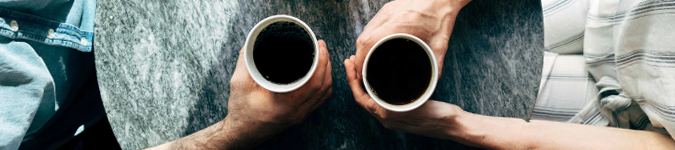 2 people having coffee | Which Markets Your Practice Better? Paid vs. Unpaid Social Media Posts | Brighter Vision Web Solutions | Marketing Blog for Therapists