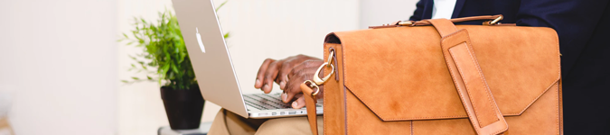 Macbook, leather briefcase | How to Build a Long-Lasting Brand for Your Private Practice | Brighter Vision Web Solutions | Marketing Blog for Therapists