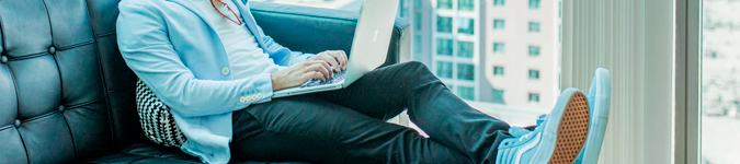 Male on laptop with feet up | 5 Ways to Freshen Up Your Private Practice & Attract New Clients | Brighter Vision Web Solutions | Marketing Blog for Therapists