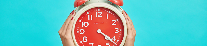 Red clock on turquoise background | The Best Practices for Therapist Marketing on Instagram in 2019 | Brighter Vision Marketing Blog for Therapists | Therapist Websites & Marketing for Therapists