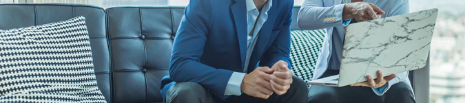 business men, laptop, marble case | 3 Reasons Why Teletherapy Could Be the Boost Your Practice Needs | Brighter Vision | Marketing Blog for Therapists
