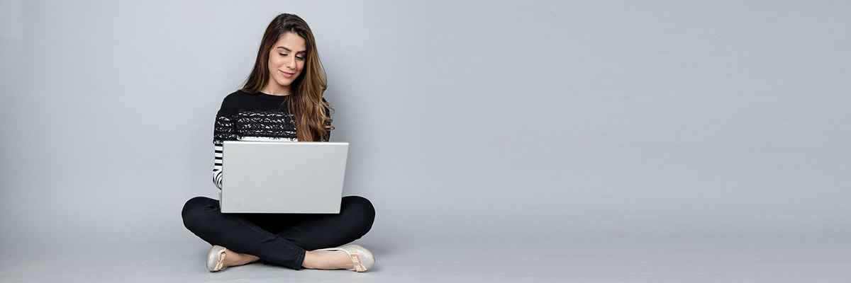 Woman typing on laptop | How to Write the Best Content for Your Private Practice Website | Brighter Vision Web Solutions | Marketing Blog for Therapists