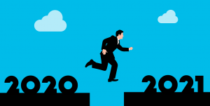 Cartoon business man jumping from 2020 to 2021 | Looking Back at 2020 – A Retrospective | Brighter Vision | Marketing Blog for Therapists