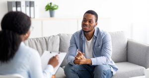 Patient talking to therapist in office