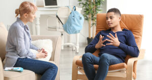 Therapist chats with teen client