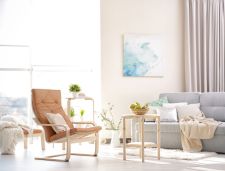 therapy office with couch, chair, and natural light