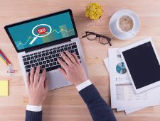 SEO magnifying glass on laptop screen