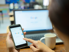 Person using Google on smart phone