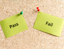 Corkboard with Pass and Fail notes pinned